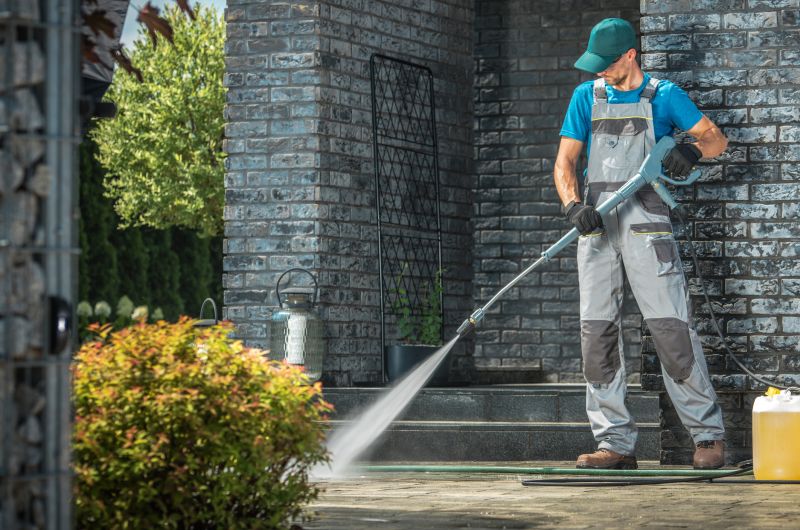 Technician Operating Powerwasher